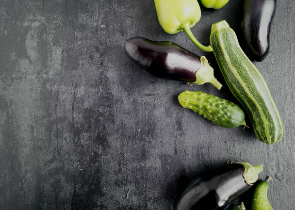 Vegetables on a dark background. free space left. - Foto, imagen