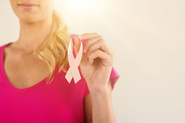 woman holding pink breast cancer  - Valokuva, kuva