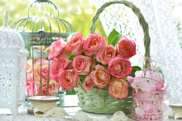 bunch of beautiful roses in wicker basket - Fotoğraf, Görsel