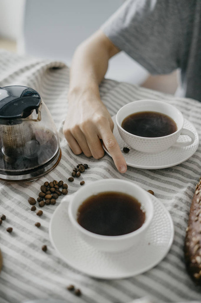 Mug with coffee in the hand of woman - Valokuva, kuva