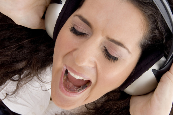 Pretty woman enjoying loud music - Zdjęcie, obraz