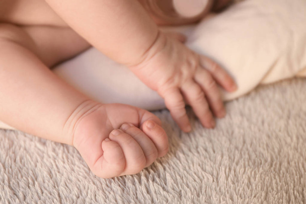 Hands of cute little baby lying  - Фото, изображение