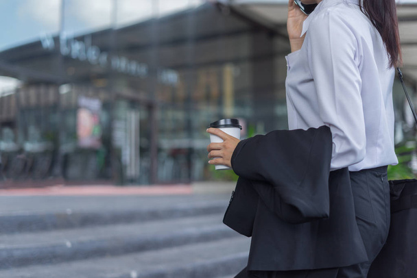 modern business woman talking over smartphone at street, business concept - Photo, Image