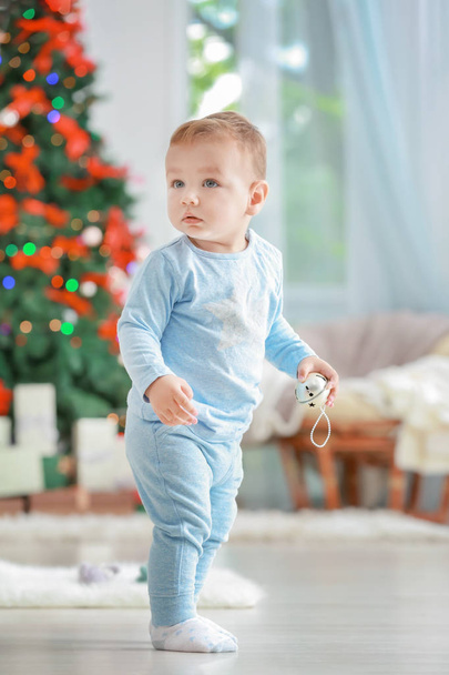 Cute little baby in room decorated for Christmas - Фото, зображення