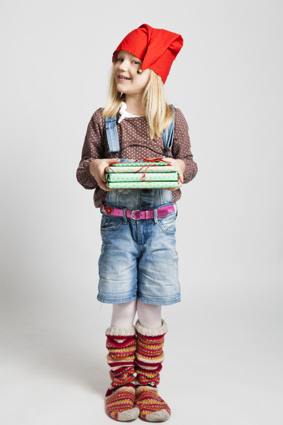Smiling girl holding Christmas gifts - Foto, Bild