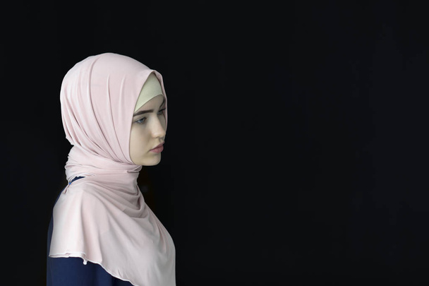 Portrait of a beautiful Muslim woman wearing hijab, isolated - Zdjęcie, obraz