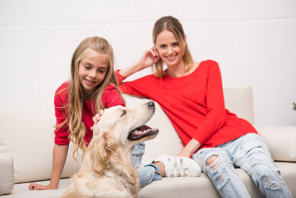 mother and daughter with dog - Fotoğraf, Görsel