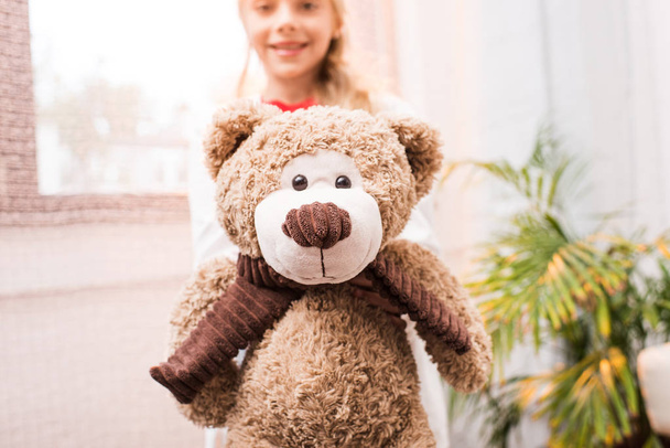 child with teddy bear - Фото, зображення