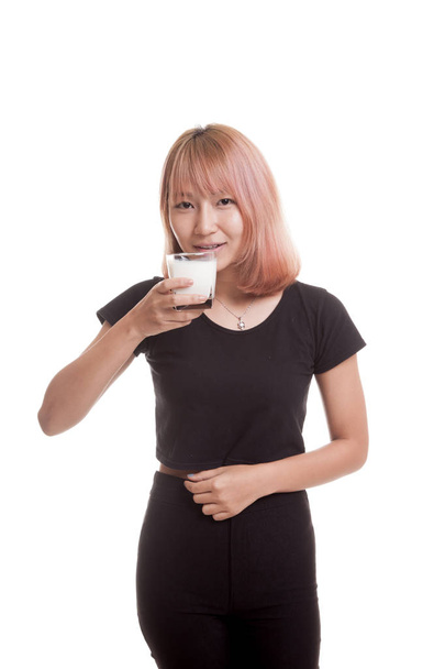 Healthy Asian woman drinking a glass of milk. - Zdjęcie, obraz