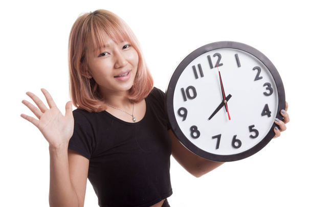 Happy Young Asian woman with a clock. - Φωτογραφία, εικόνα