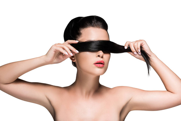 女性はポニーテールで目を覆っています。 - 写真・画像