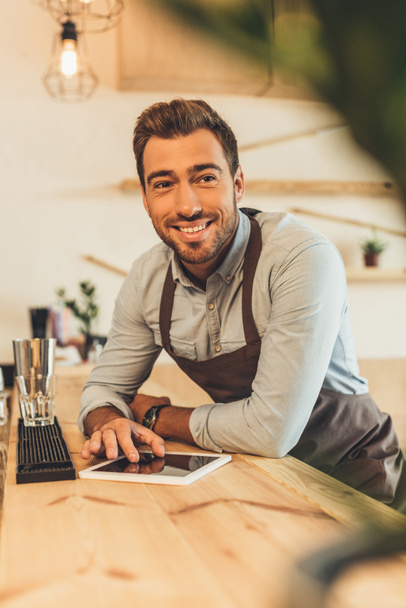 smiling barista with tablet - Photo, Image