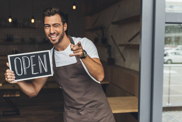 waiter holding chalkboard with open word - Photo, Image