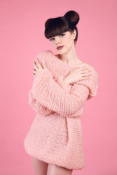 Fashion studio teen look style over pink. Fashionable young girl - Fotó, kép