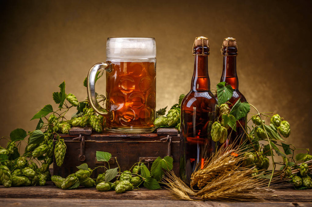 Glass and bottles of beer - Фото, зображення