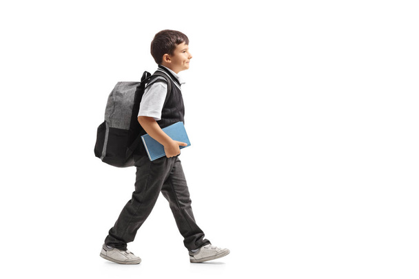 Schoolboy with a backpack walking - Foto, Bild