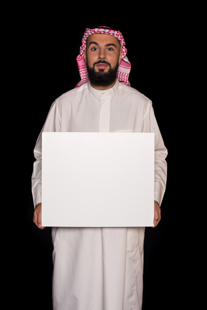 homem muçulmano segurando placa em branco
 - Foto, Imagem