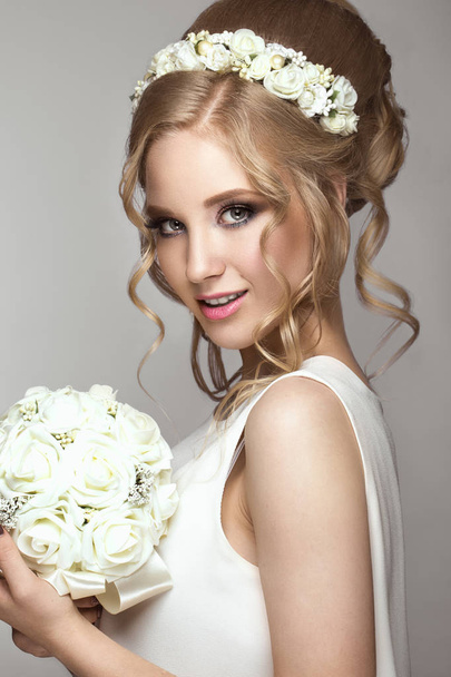 beautiful blond girl in image of the bride with white flowers on her head. Beauty face. - Photo, image