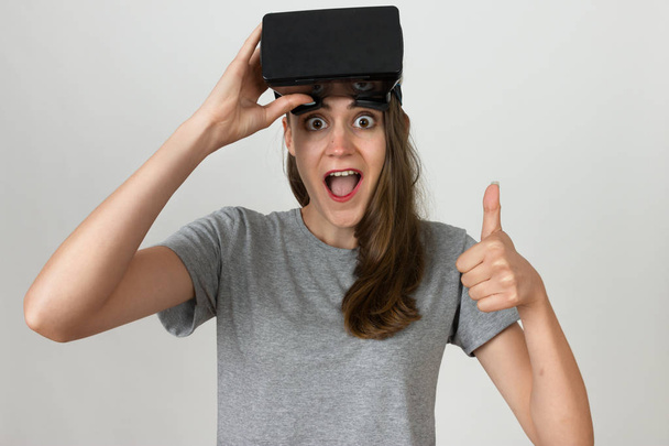 Girl in the helmet of virtual reality - Фото, зображення