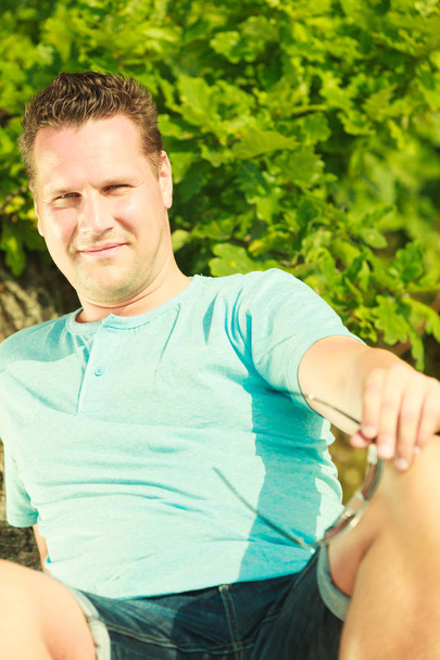 Man spending free time outside, looking at nature - Photo, Image