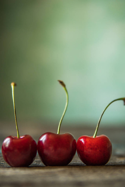 Cherry on wooden board. Tree cherries, selective focus - Foto, Imagen