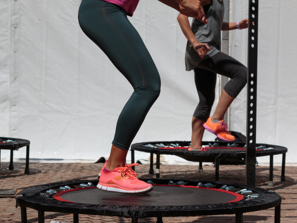 Mini Trampoline Workout: Girl doing Fitness Exercise in Class at - Photo, Image