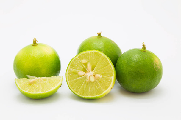 Slide limes on white background - Foto, afbeelding