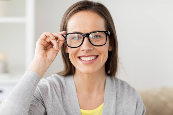 happy smiling middle aged woman in glasses at home - Foto, Imagem