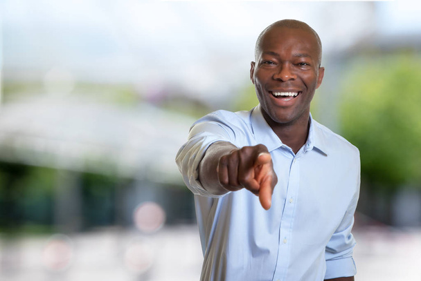 Pointing african american businessman - Photo, image