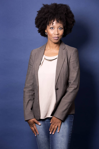 black casual woman on blue background - Фото, зображення