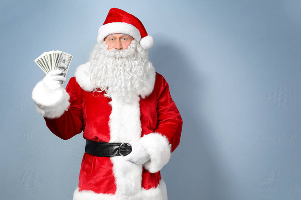 Santa Claus holding money  - Zdjęcie, obraz