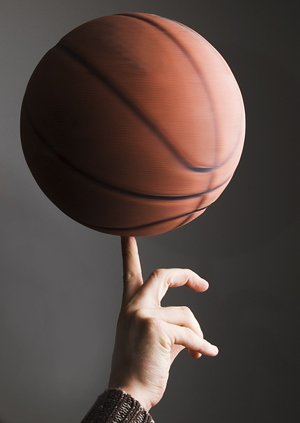 Basketball rolling on finger - Фото, зображення