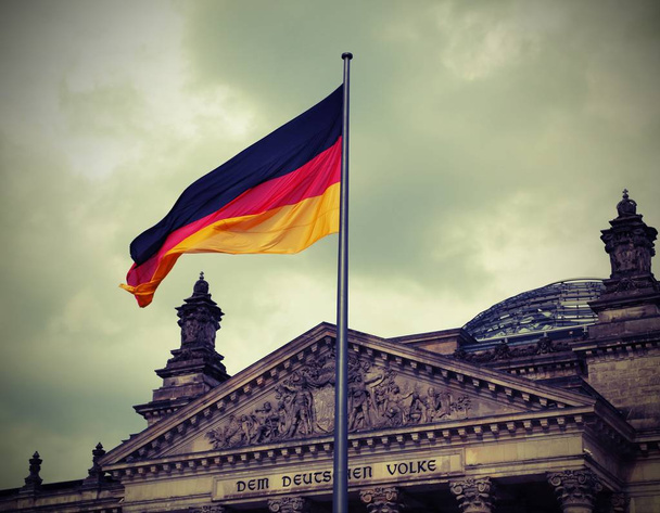 Reichstag building is Parliament of Germany in Berlin with flag. - Photo, Image