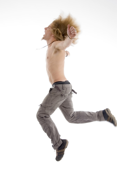 yan poz erkek havada atlama - Fotoğraf, Görsel