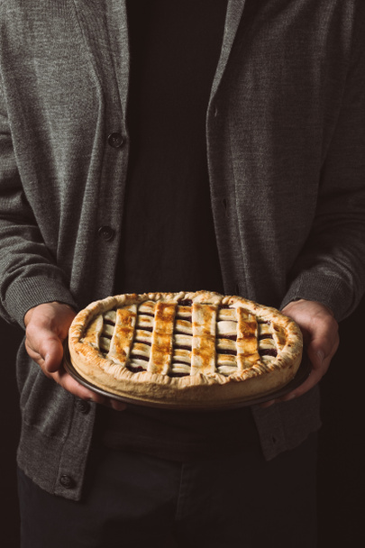 man holding homemade pie - Fotoğraf, Görsel