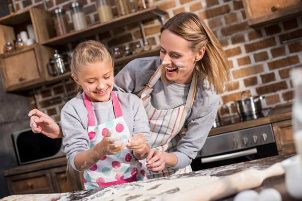 family having fun while cooking together - Photo, Image