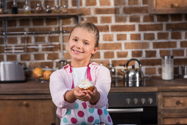 child with sweet cupcake - Фото, изображение
