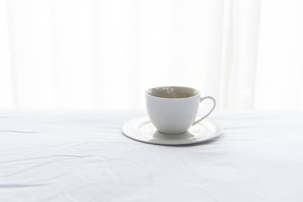 Fresh morning coffee on the white bed in the sunny day.  Lifestyle Concept - Φωτογραφία, εικόνα