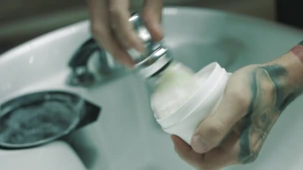 Barber whips shaving foam. - Footage, Video