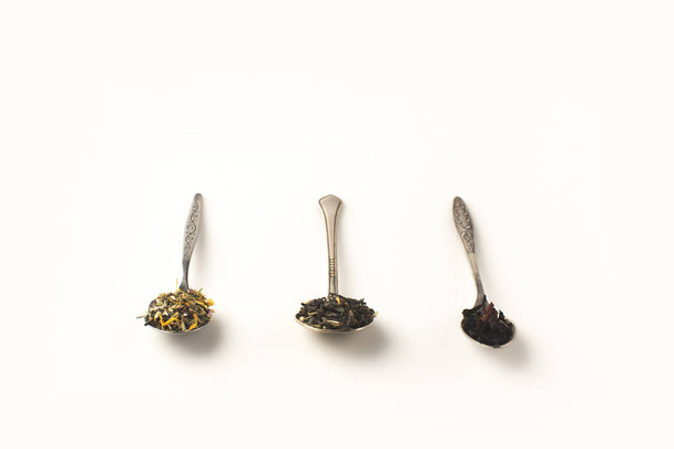 dry herbs in spoons  - Fotó, kép