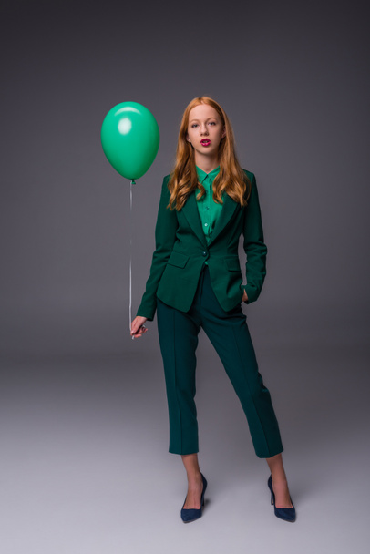 stylish girl with green balloon - Foto, afbeelding