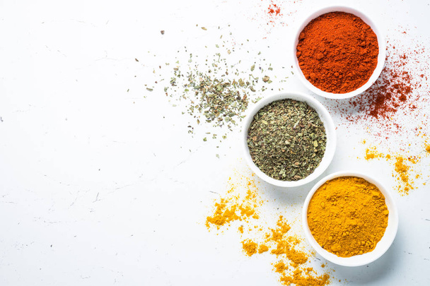 Various spices in a bowls on white.  - Photo, Image