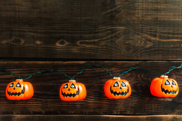 Halloween pumpkin heads on wooden background - Photo, Image