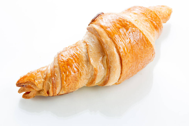Croissant em fundo branco. Vista superior
. - Foto, Imagem