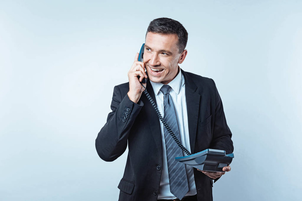 Successful man of business talking with partner on telephone - Fotografie, Obrázek