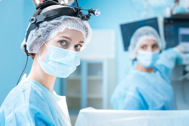 Amazing medical worker looking straight at camera - Zdjęcie, obraz