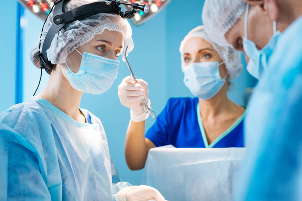 Competent surgeon being at operation room - Foto, Imagen