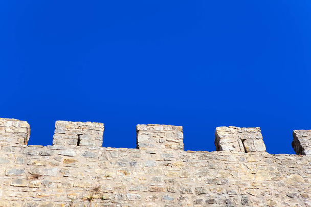Stone wall and blue sky , background - Zdjęcie, obraz