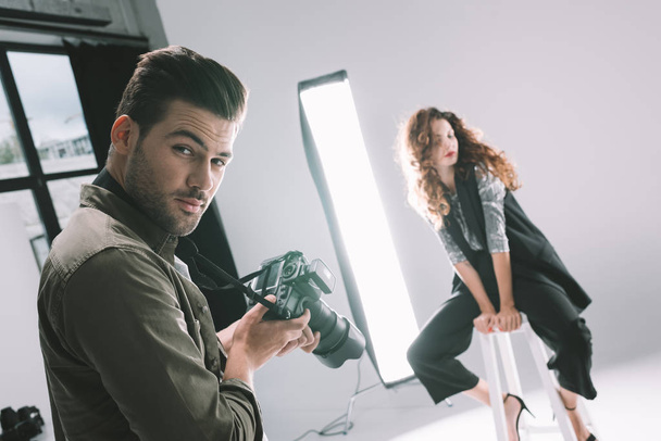 photographer and model on fashion shoot - 写真・画像