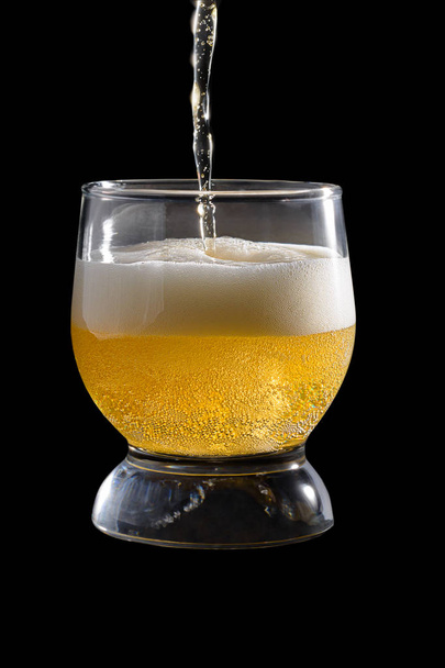 glass with amber light beer black background - Foto, Imagem